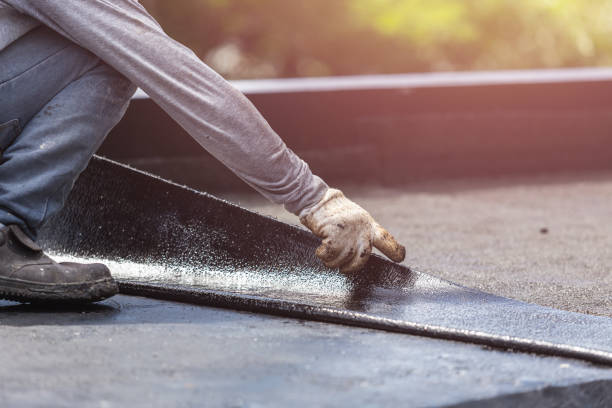 Professional Basement Waterproofing technician working in Eminence, KY